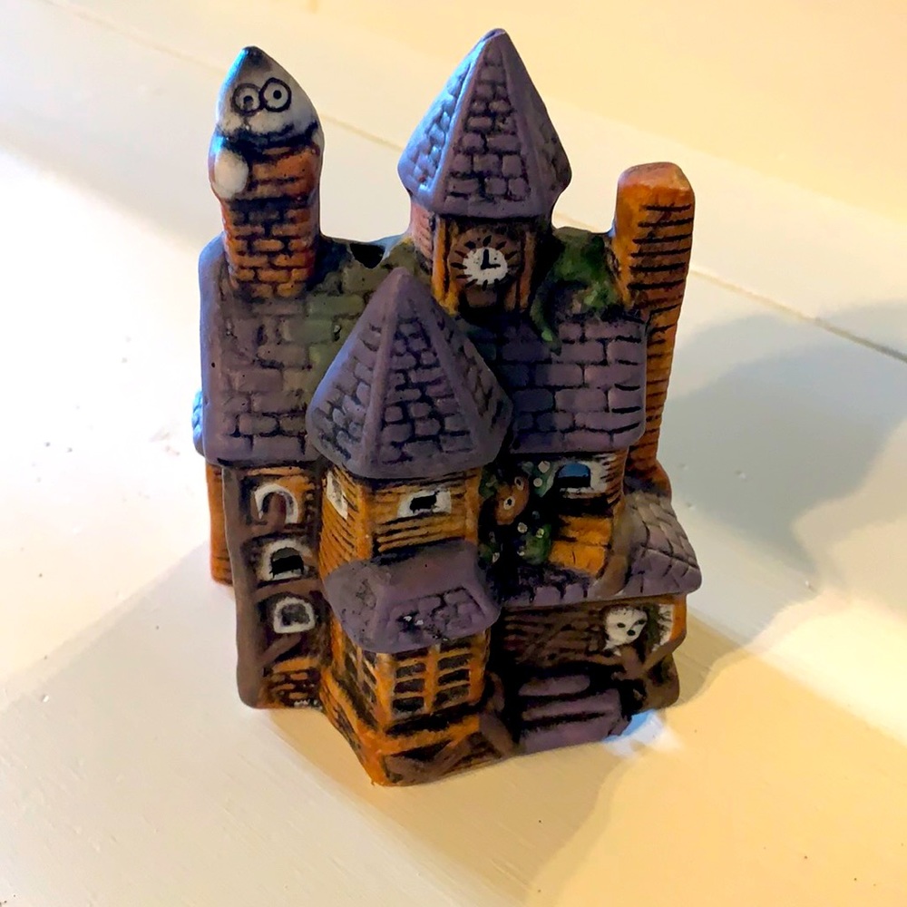 Haunted house candle holder